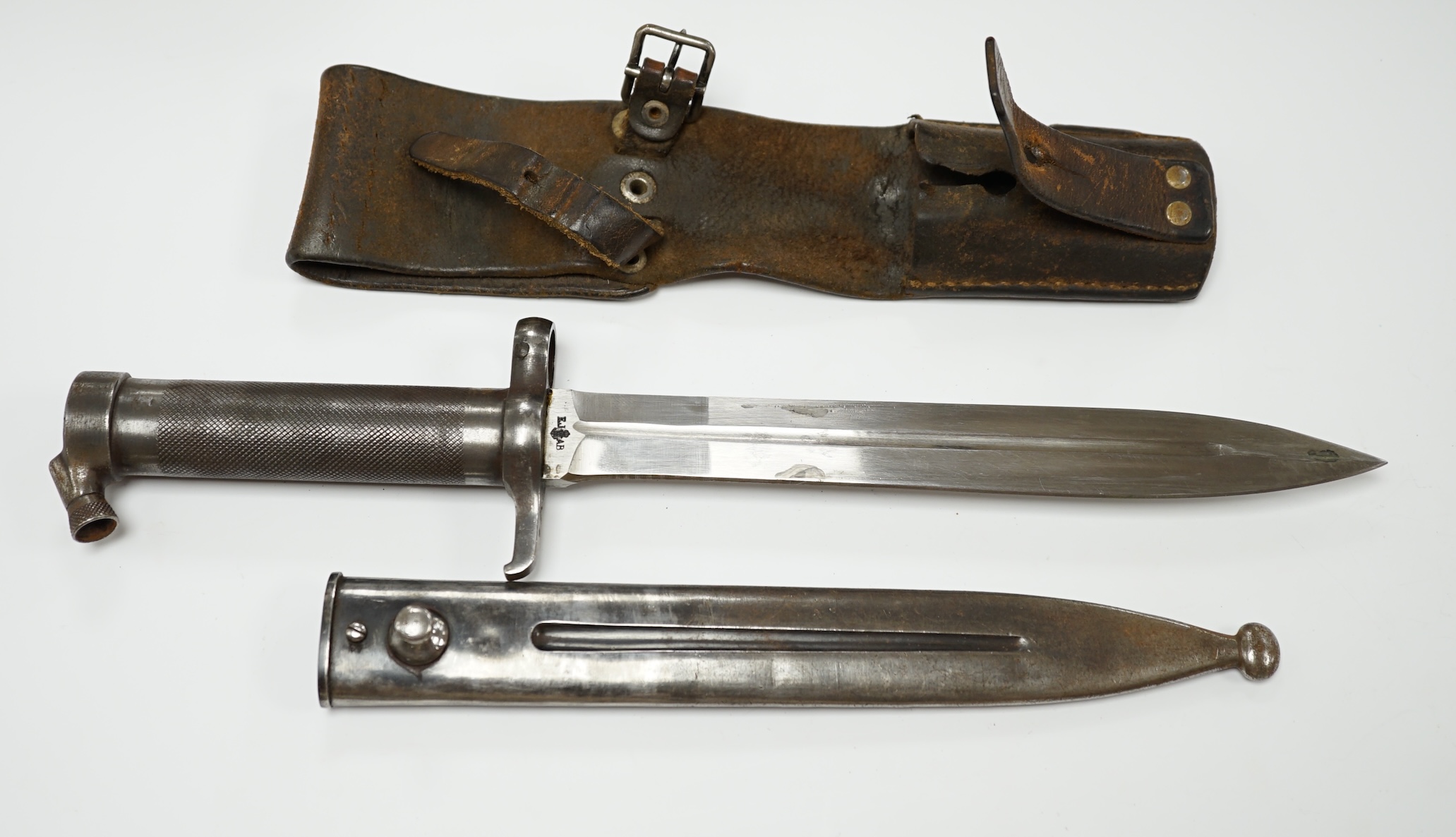 A Swedish Mauser bayonet, chequered grip in its steel scabbard with leather frog. Condition - good